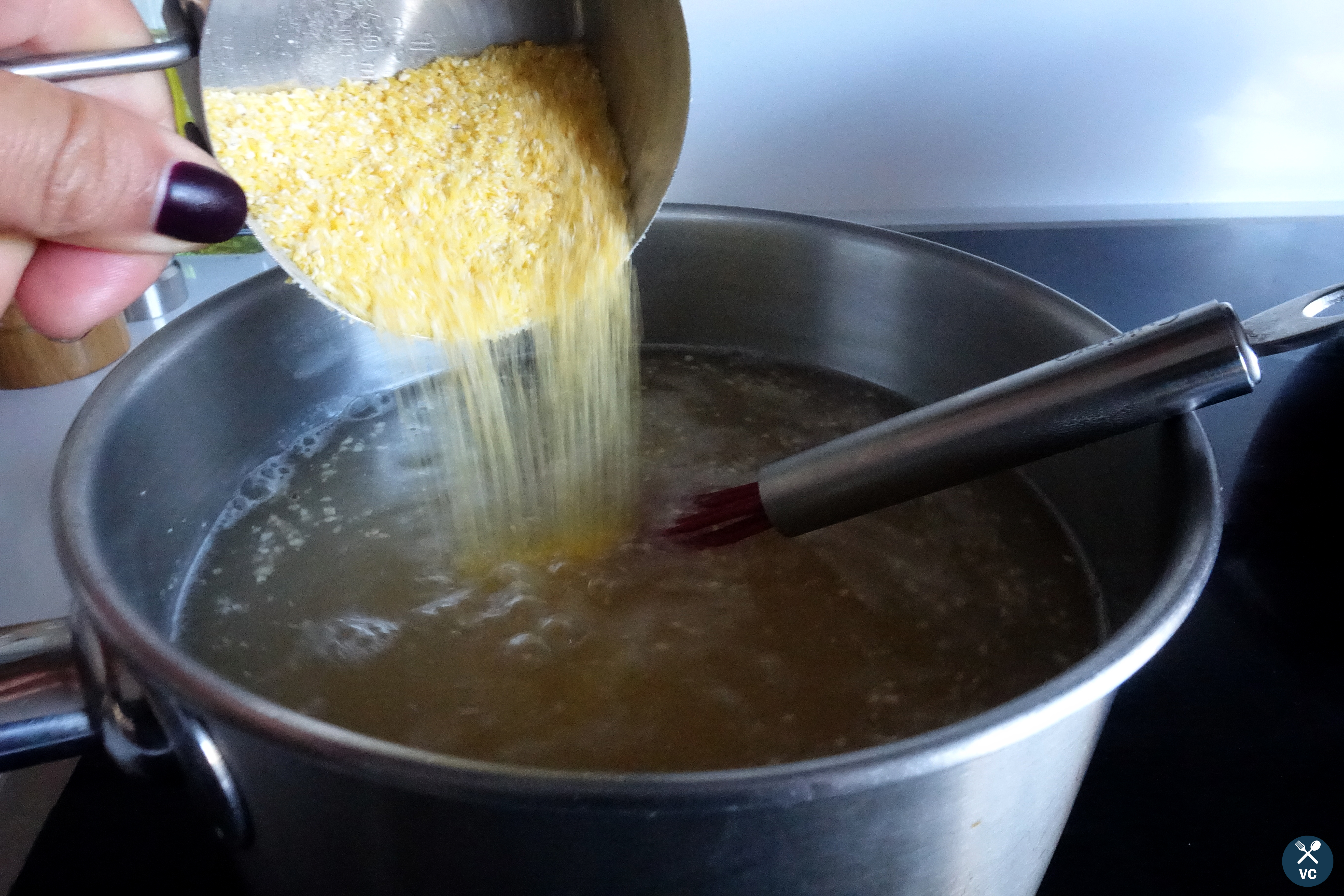 Stir Polenta into chicken broth for Simple Cheesy Polenta