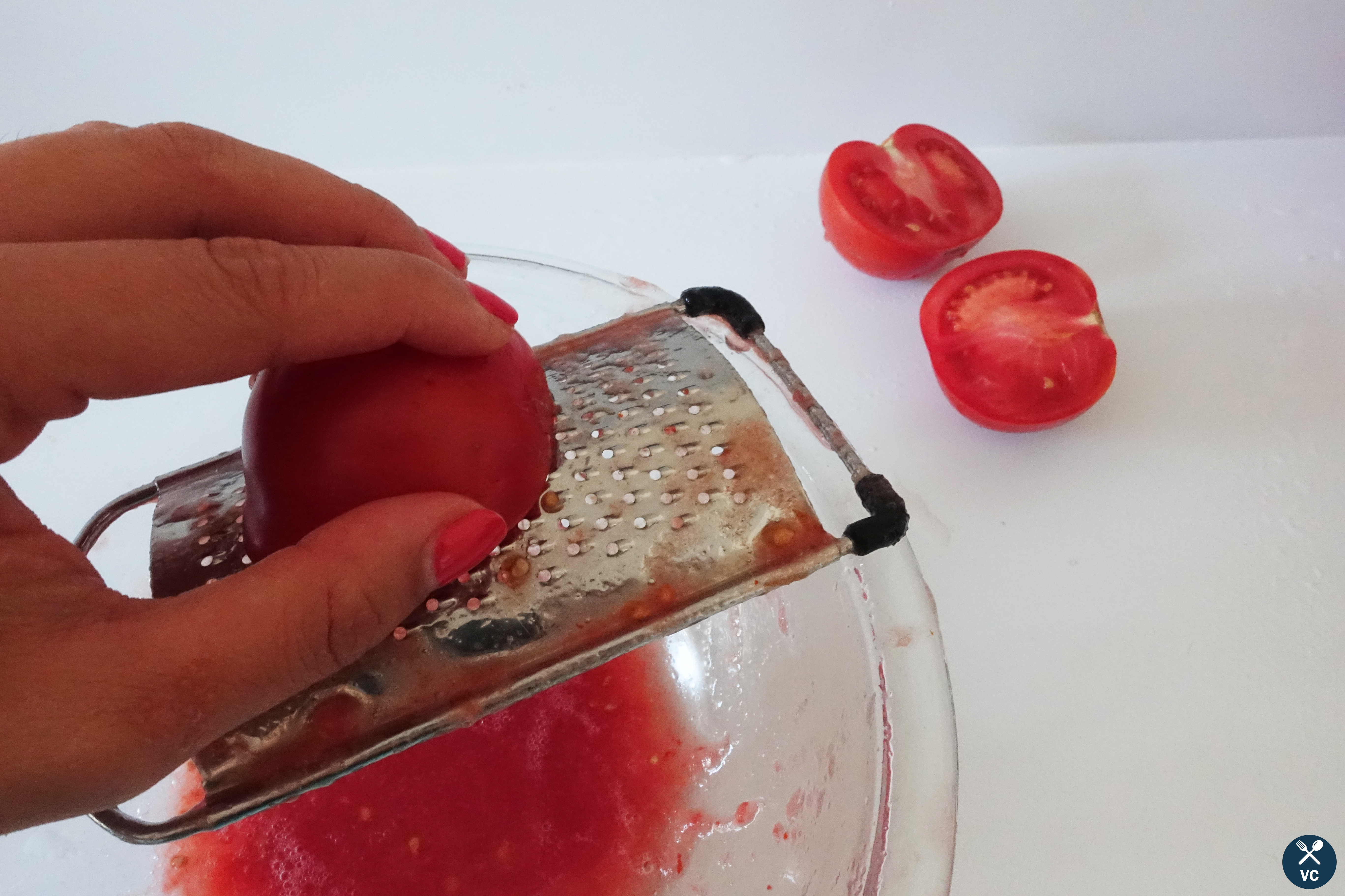 Grated tomatoes for Paella Mixta (VC in the Kitchen)