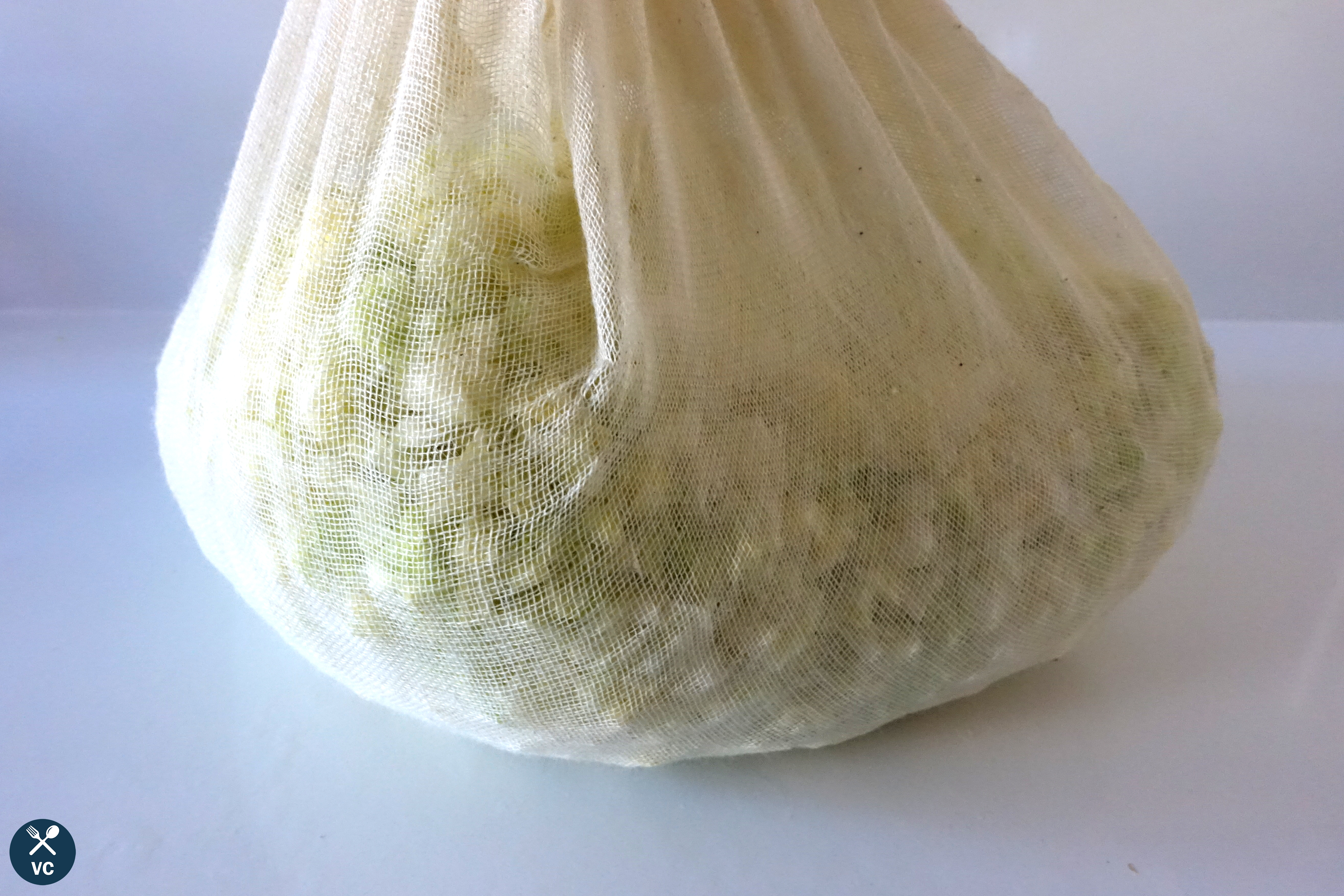 Cabbage in cheesecloth to drain for Asian pork and cabbage dumplings (VC in the Kitchen)