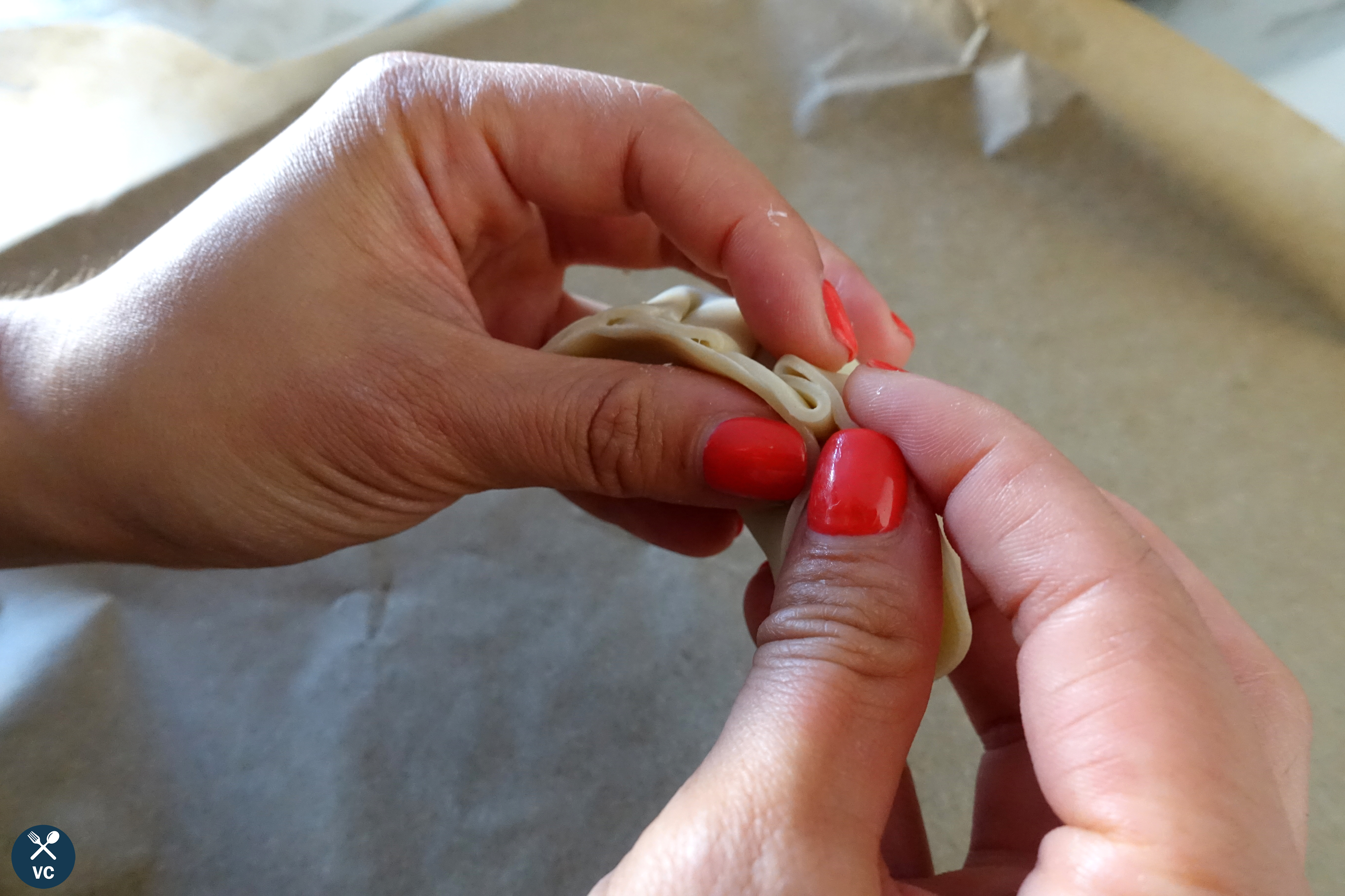 Pleating wrappers for Asian pork and cabbage dumplings (VC in the Kitchen)