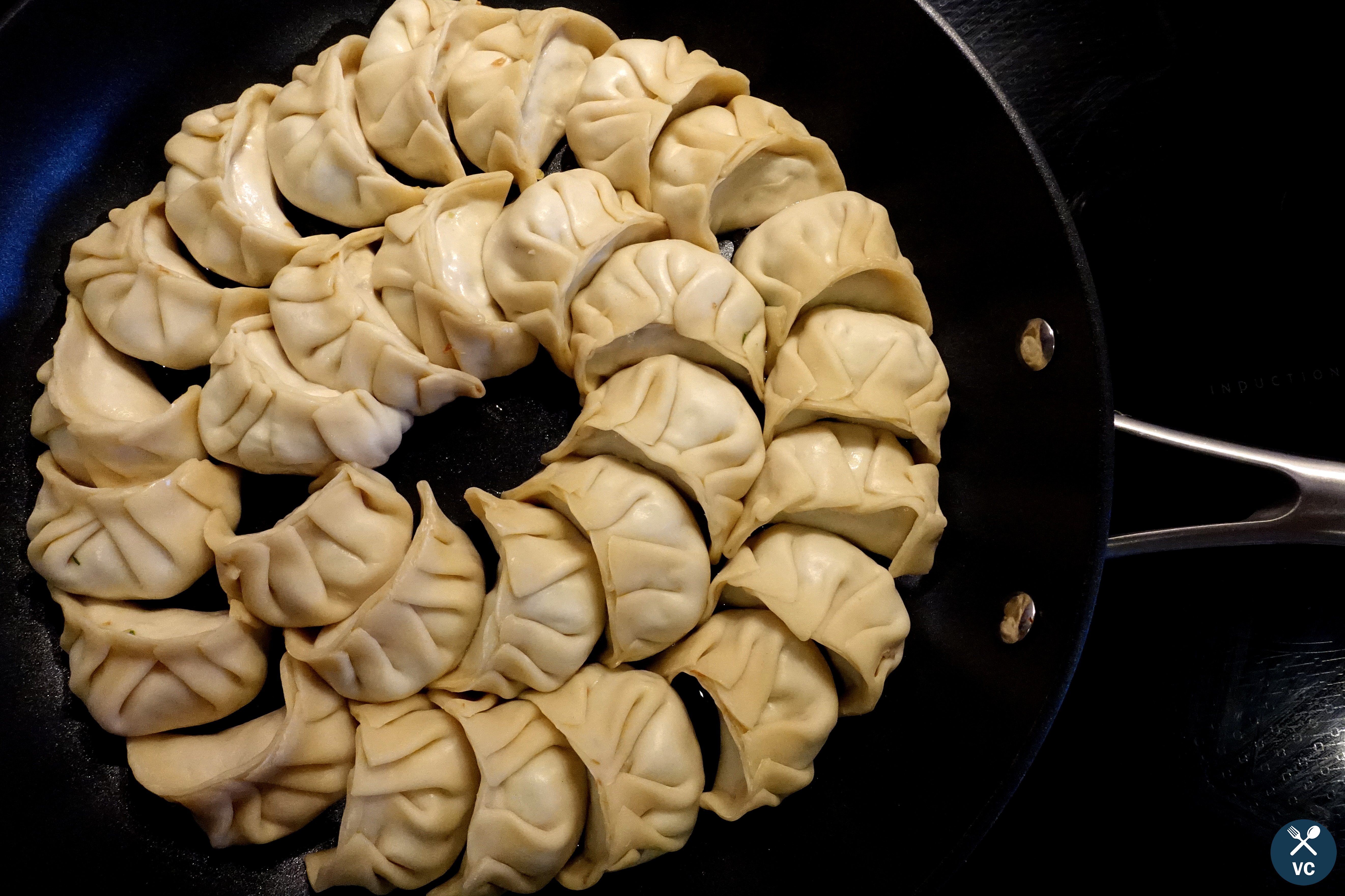 Cooking Asian pork and cabbage dumplings in a skillet (VC in the Kitchen)