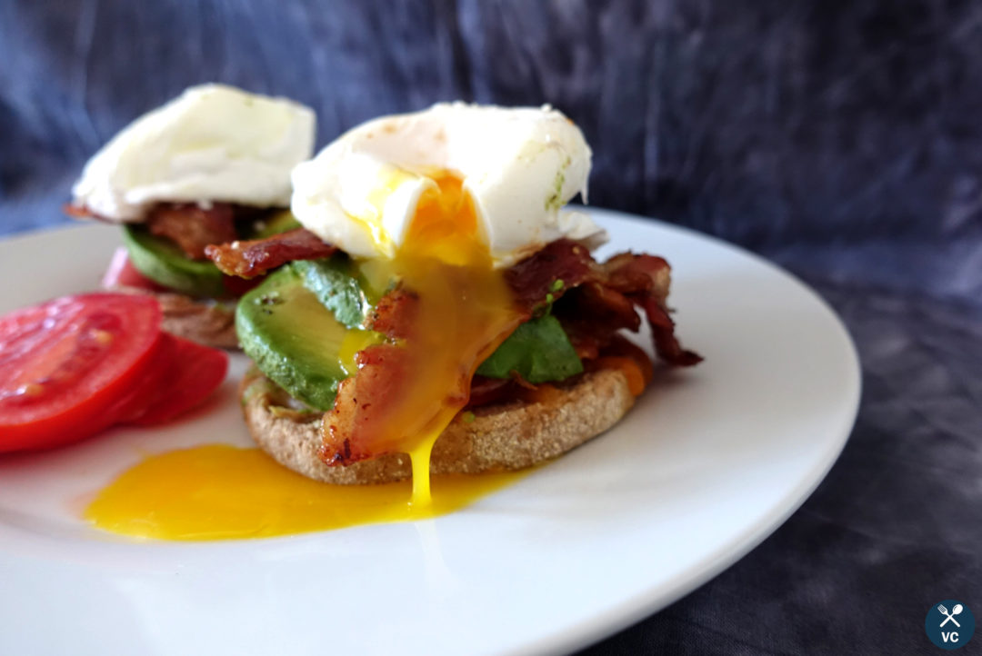 Oozing egg yolk of an open-faced breakfast sandwich (VC in the Kitchen)