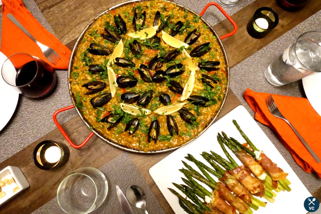 Paella mixta (paella with seafood and meat) on the dinner table (VC in the Kitchen)